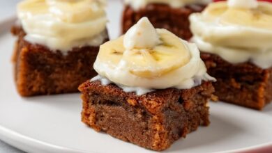 Banana Bread Brownies combine the rich, moist texture of banana bread with the indulgence of a dessert bar. The bars are packed with ripe bananas and creamy Greek yogurt, creating a soft and flavorful bite. Topped with a buttery vanilla glaze, these brownies are the perfect treat for banana lovers and make an irresistible dessert or snack.