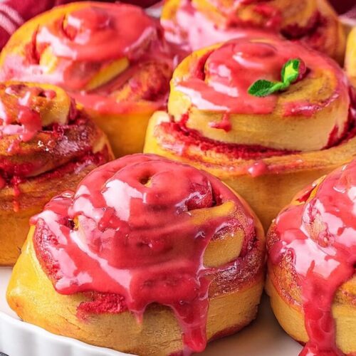 These Strawberry Rolls are a delightful treat combining soft, fluffy dough with a creamy strawberry and white chocolate filling, topped with a fresh strawberry glaze. The tangzhong roux ensures the dough stays moist and tender, while the roasted strawberry puree intensifies the flavor. A perfect balance of sweetness, richness, and fruitiness in every bite!